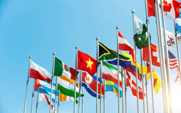 istock Set of flags fluttering in the wind against blue sky background 1582677997