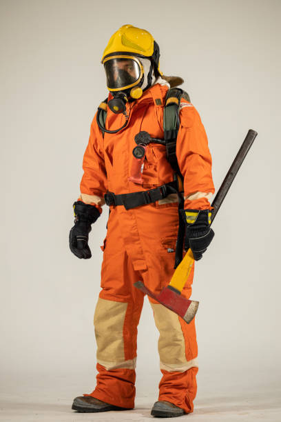istock Firefighters wearing helmets with fire safety equipment Use Twirl aerosol fire extinguishers to fight oil flames.Preventing fire accidents is an industrial safety concept. 1582678503