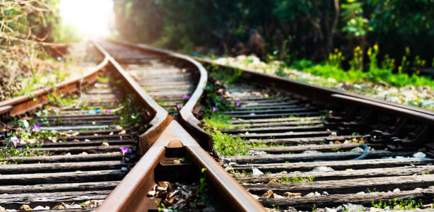 crossroad intersection of railroad tracks - connection merger road togetherness imagens e fotografias de stock