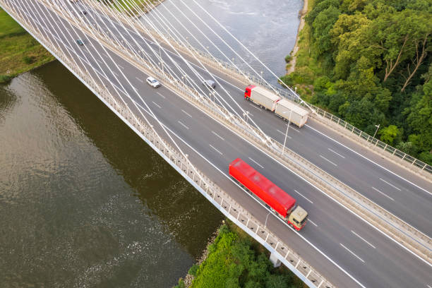 istock suspension bridge over the river (aerial) 1582681172