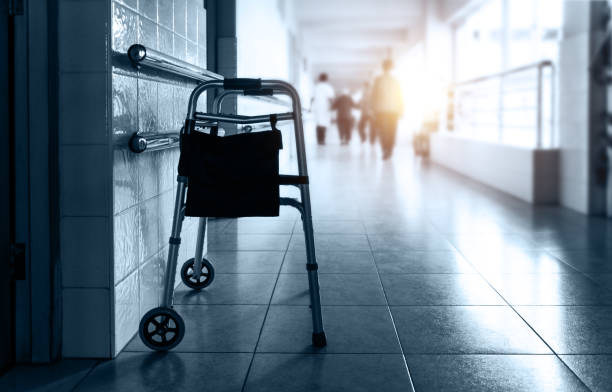 Metal rollator parked in care home hallway stock photo