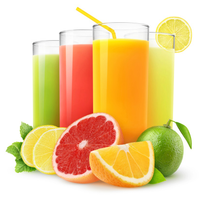 High angle view of orange fruit slice and glass of orange juice.