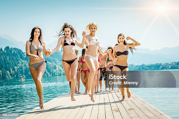 Cheering Girls At The Lake Summer Vacation Stock Photo - Download Image Now - Bikini, Beach, Teenage Girls