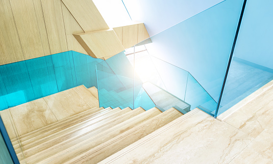 Geometric space formed by stairs and transparent handrails