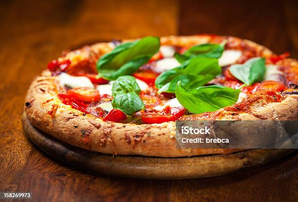 Pizza With Salami And Mozzarella Stock Photo - Download Image Now - Baked, Baked Pastry Item, Basil