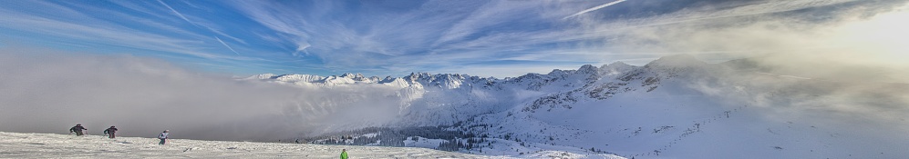 Panoramic image of a ski slope in Kanzelwand ski resort in Kleinwalsertal valley in Austria during the daytime