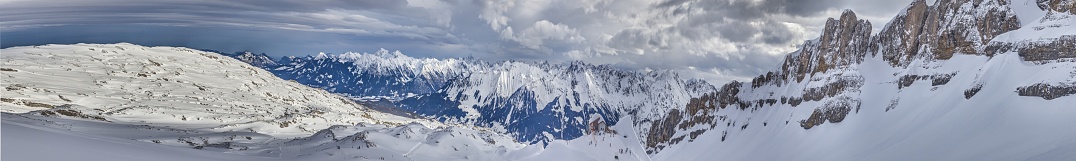 Panoramic image of a ski slope in Ifen ski resort in Kleinwalsertal valley in Austria during the daytime