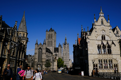 People walk in historical city center of Ghent, Belgium on July 29, 2023.