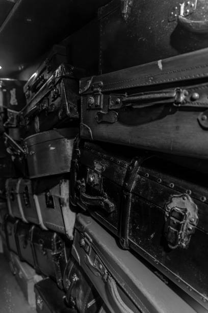 Stacked old suitcases. Black and white photography.