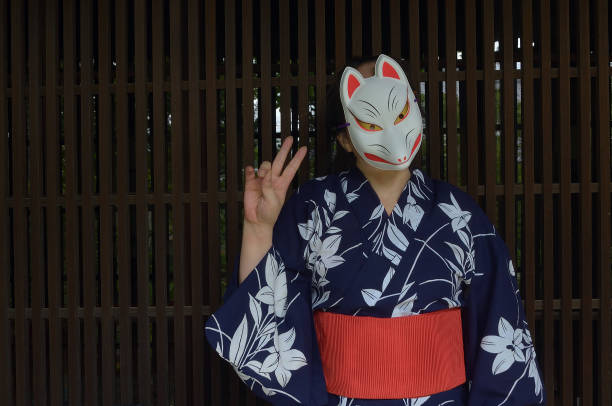 istock Woman Wearing A Fox Mask 1582726069