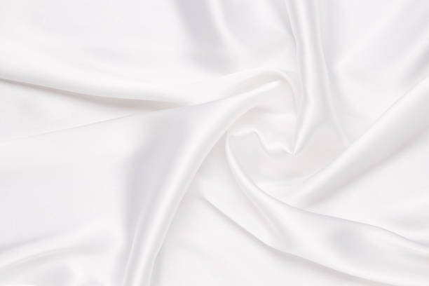 istock Elegance white satin silk with waves, abstract background luxury cloth, elegant wallpaper design. 1582739564