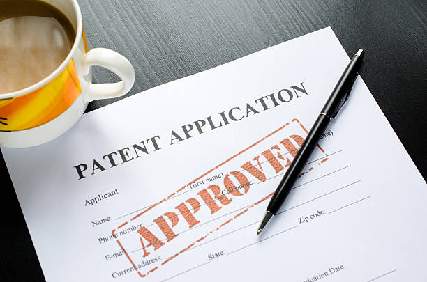 patent application - approved patent application - approved patent stock pictures, royalty-free photos & images