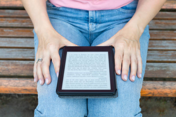 istock Moscow, Russia - July 04, 2023: woman reading e-book . 1582742783