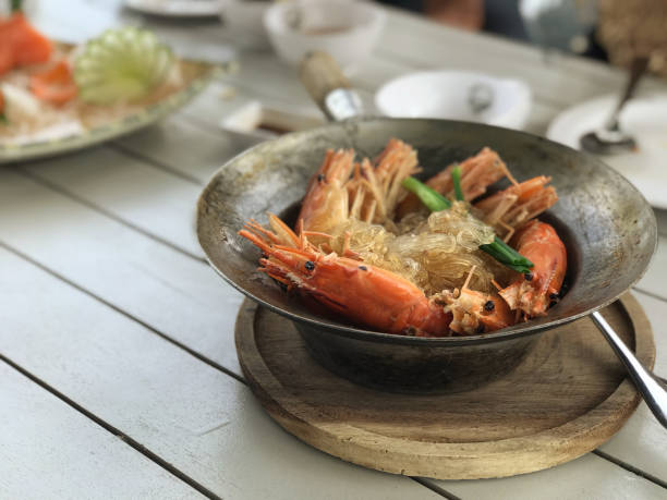istock Shrimp with vermicelli in a bowl on wooden table 1582745489