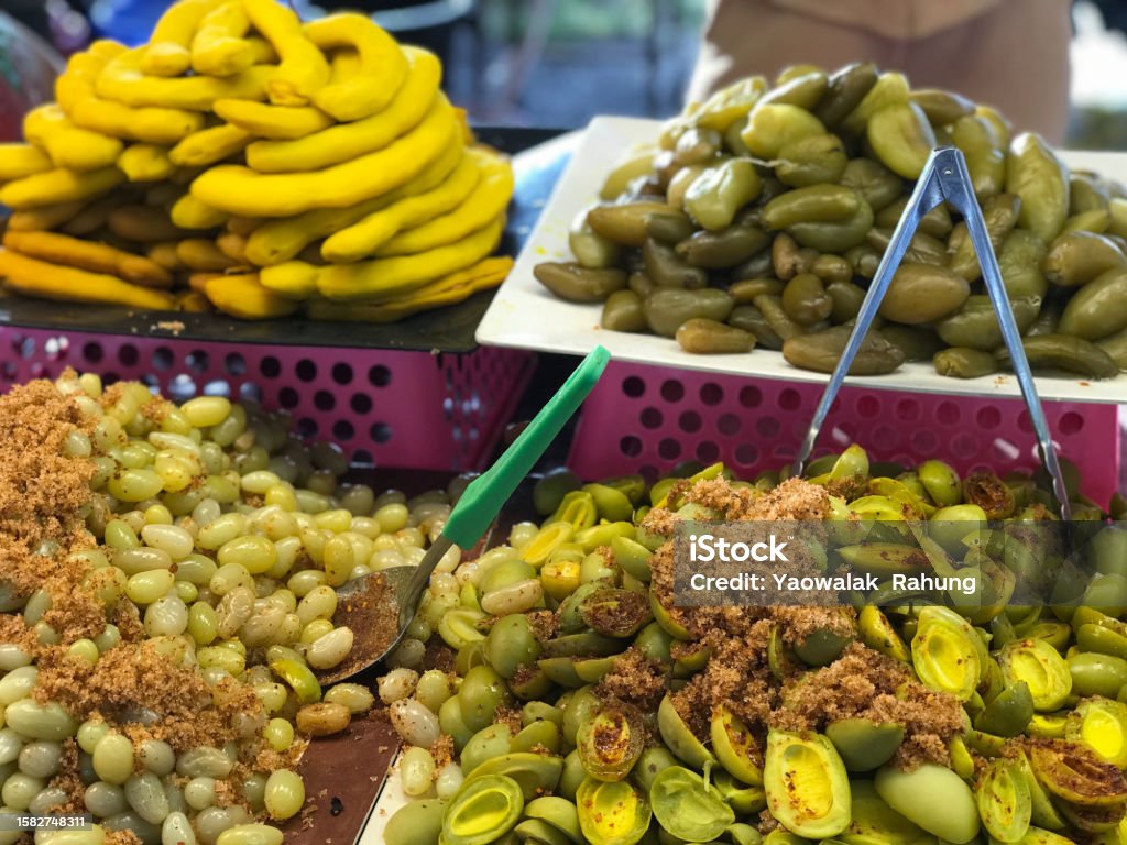 Pickled olives on the street market in Bangkok, Thailand. Black Color Stock Photo