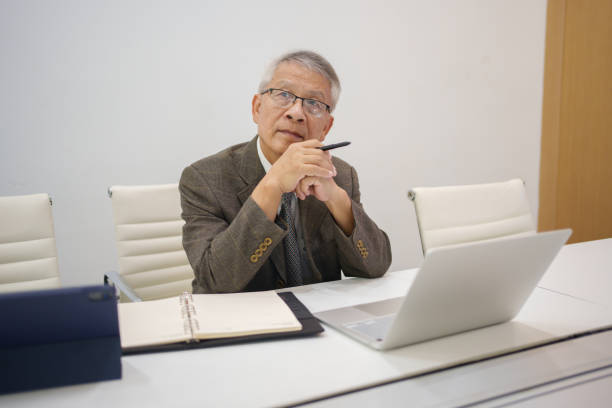 istock Elderly male businessman thinking 1582768651