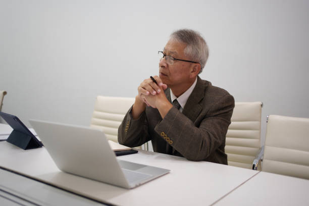 istock Elderly male businessman thinking 1582769172