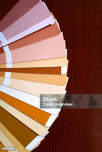 Open Pantone Sample Colors Catalogue On Wood Background Stock Photo - Download Image Now