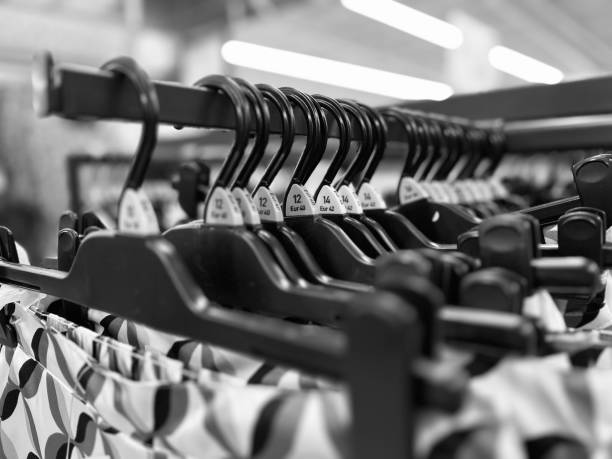 istock Clothing hangers in a retail store 1582791621