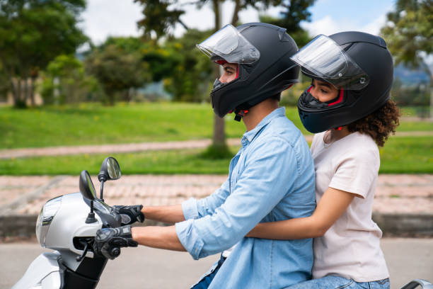 istock Loving young couple riding a motorcycle 1582801299