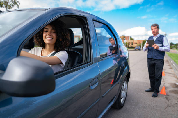 istock Woman taking a driving test - learning to drive 1582801883