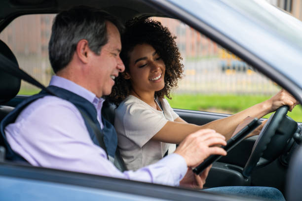 istock Happy woman taking her driving test 1582802376