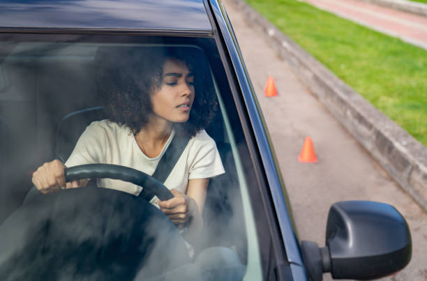 istock Woman taking her driving test but struggling with parallel parking 1582802905
