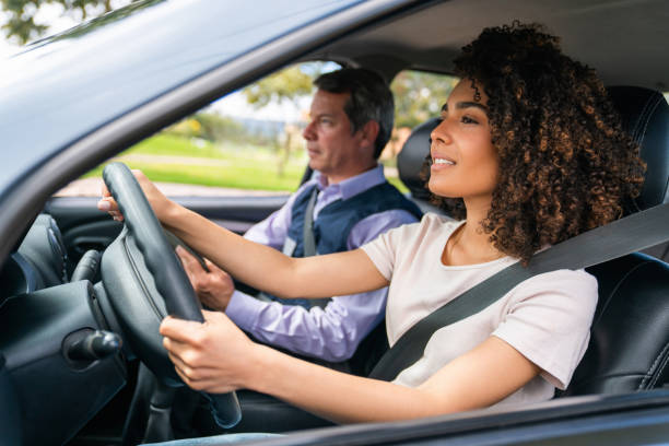 istock Young woman taking her driving test 1582802918