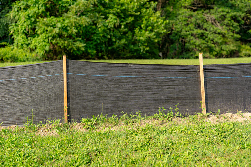 Silt Fence fabric with wooden posts installed prior to the start of construction.