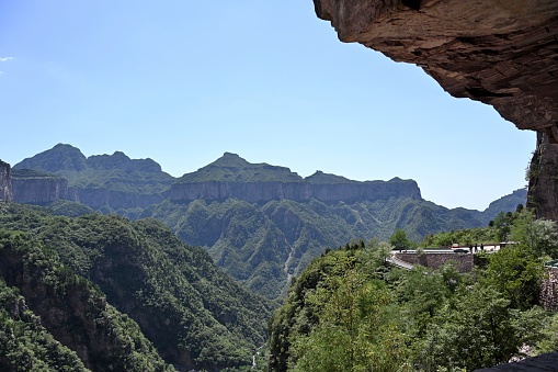 Hui county, Xinxiang City, Henan Province,\nSouth Taihang Huilong Tianjie Mountain, national AAAA tourist scenic spot, 1763 meters above sea level.\nHere, the mountains, cliffs, vegetation covered, the scenery is magnificent.\nHere, the world famous thing is: in the 1990s, the people here built an 8000 meter cliff road on the cliffs of thousands of mountains. This spirit will always inspire future generations.A steady stream of visitors come here to visit.