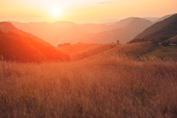 sunset above hills