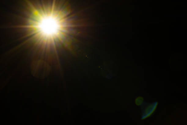 istock Blurred image Sun flare on the black background 1582822316