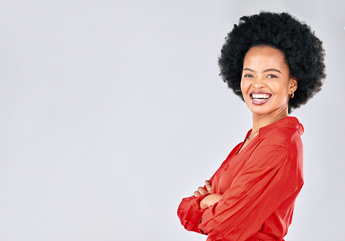 Portrait, fashion and mockup with an afro black woman in studio on a white background for trendy style. Space, confident and red clothes with a happy young female model posing in a clothing outfit
