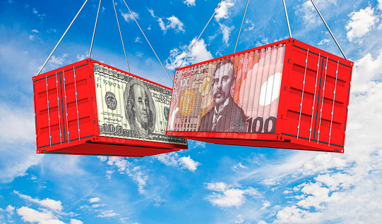 USA and New Zealand trade war. US Dollar and New Zealand Dollar crashed containers on sky at cloudy background