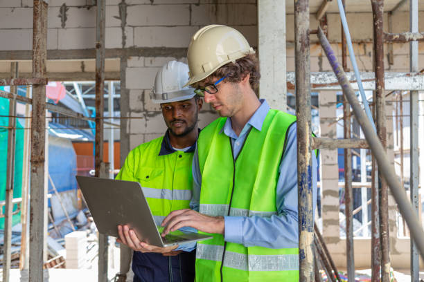 istock Engineer under checking the industry chilled water fan coil unit air conditioner is water cooling tower air chiller HVAC system of large industrial building to control air system 1582871187