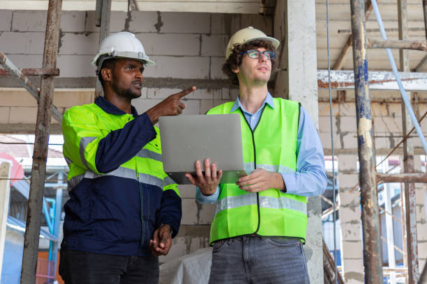 istock Engineer under checking the industry chilled water fan coil unit air conditioner is water cooling tower air chiller HVAC system of large industrial building to control air system 1582871547