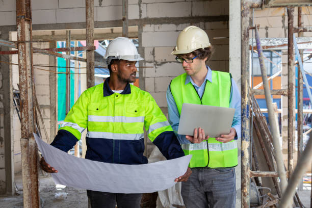 istock Engineer under checking the industry chilled water fan coil unit air conditioner is water cooling tower air chiller HVAC system of large industrial building to control air system 1582871747