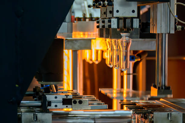 istock The drinking water bottle manufacturing process by blow mold machine. 1582880165