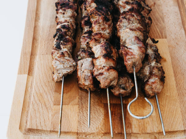 istock Barbecued lean cubed pork kebabs close up 1582911419