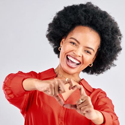 Portrait, mockup and black woman with heart hands, support and review on a white studio background. Face, female person and happy model with symbol for love, like and  emoji with motivation and hope