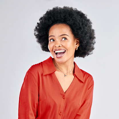 Thinking, happy and a black woman hearing gossip or good news in studio on a white background. Idea, smile and a curious young female person with an afro eavesdropping or listening to a secret