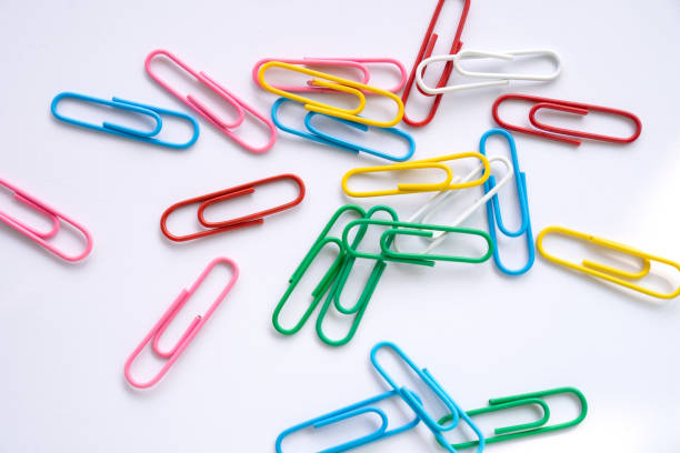 istock Multi colours paper clips isolated on a white background 1582942909