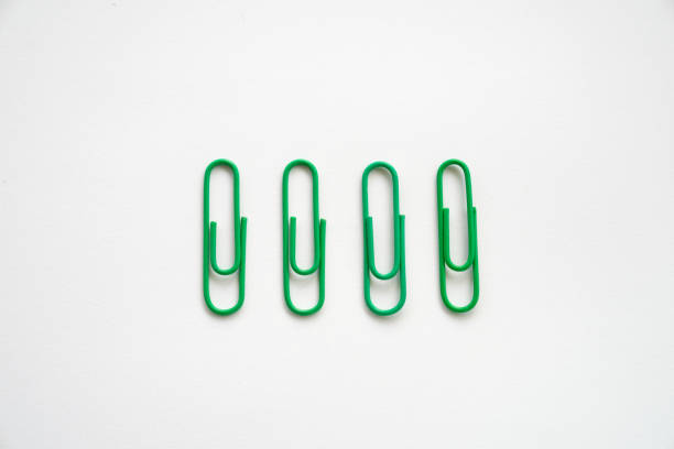 istock Multi colours paper clips isolated on a white background 1582943962