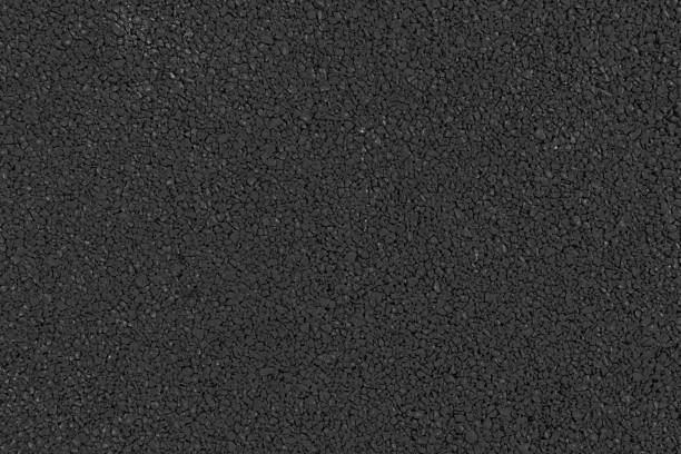 istock Black asphalt road texture background. Texture of black wall. 1582956040