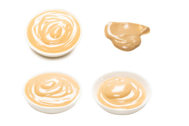 istock Mushroom sauce in a bowl isolated on white background. 1582973895