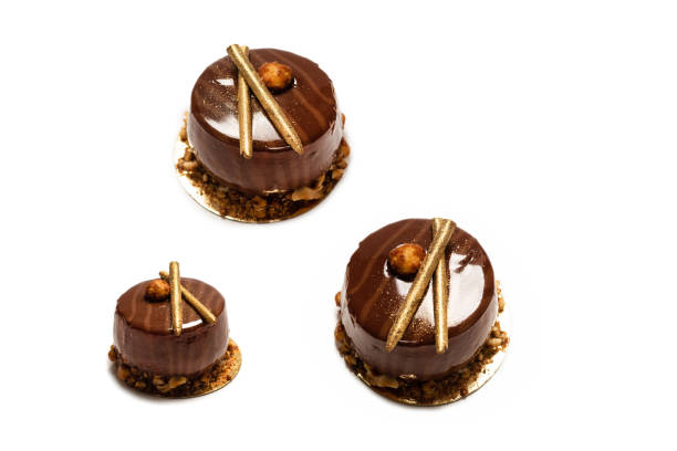 istock Chocolate and caramel cake isolated on a white background. 1582973907