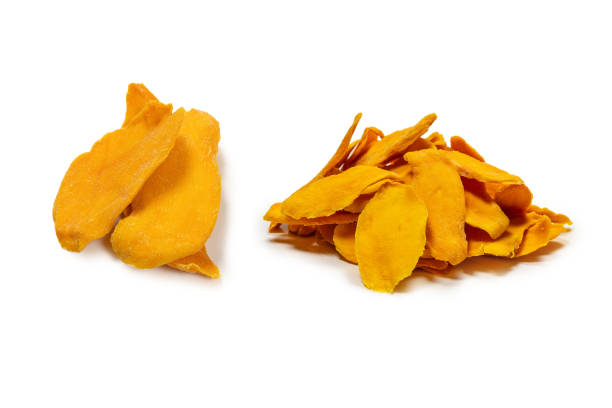 istock Dry tasty mango slices isolated on a white background. 1582973941