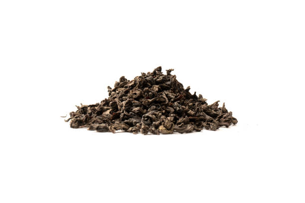 istock Dried tea leaves isolated on a white background. 1582974497