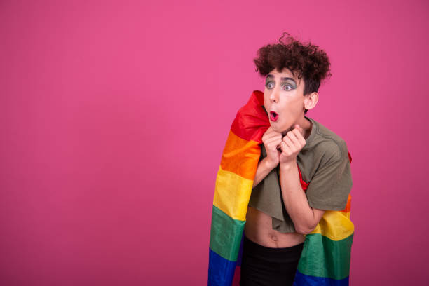 istock Make up. Funny drag queen posing in the studio on a pink background. 1582977969