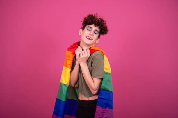 istock Make up. Funny drag queen posing in the studio on a pink background. 1582982324